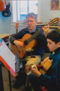 Kevin Collins teaches guitar at the Red Barn Music School in Amherst Massachusetts